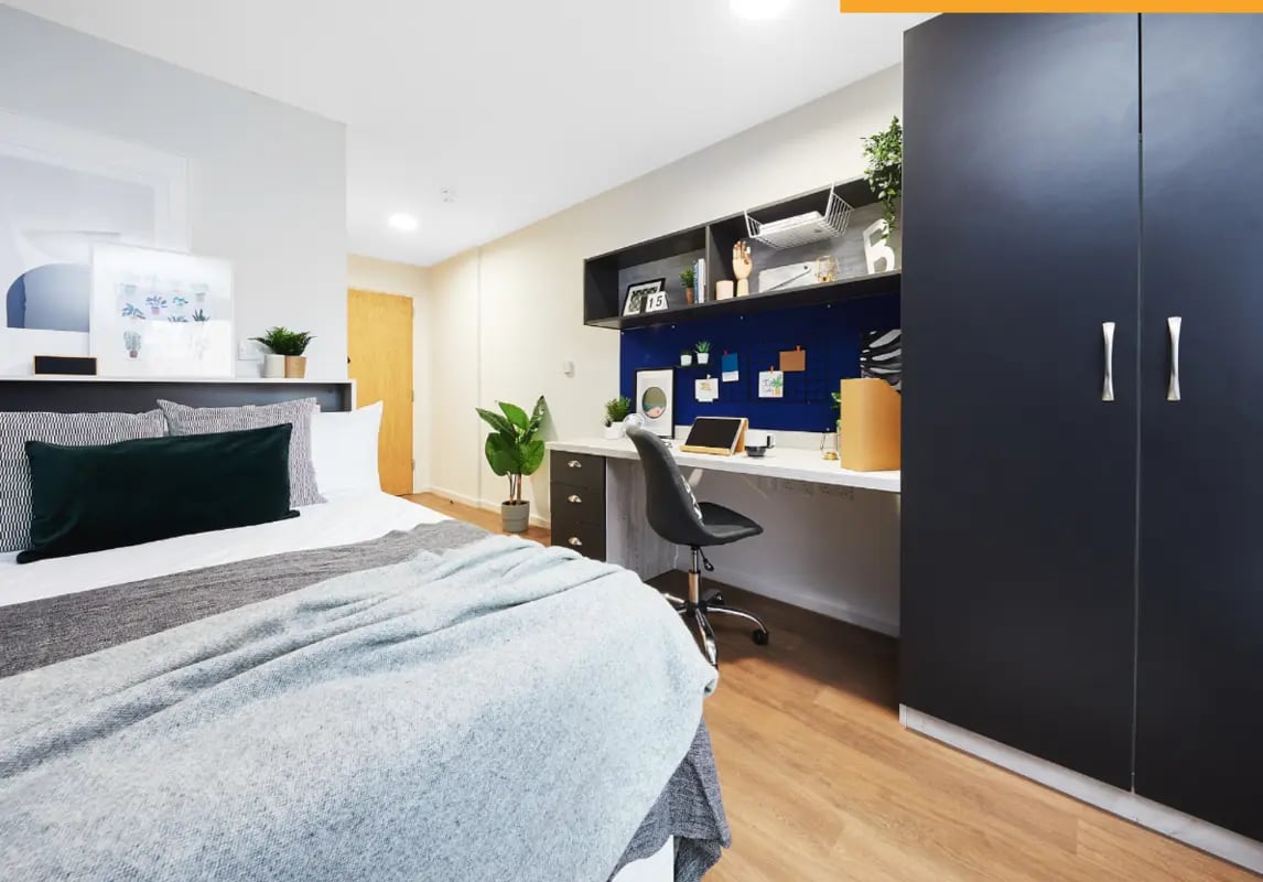 Bed desk chair and wardrobe bedroom at Tudor Place in Chester Student Accommodation